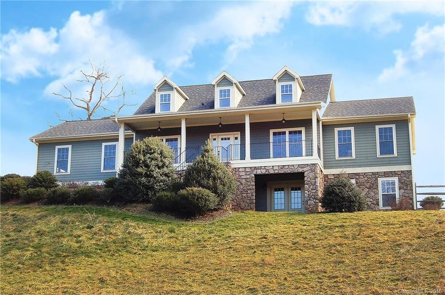 Beautiful country home, backs up to mountain farm, 20 minutes from downtown Asheville with amazing short and long range mountain views. Features include vaulted ceiling, fireplace, granite kitchen, hardwood and ceramic floors, ample natural light, and amazing connection to the outdoors. Dining room with French doors to deck and rocking chair front porch. Modern floor-plan with master suite on main, custom tile shower and walk-in closet. Bonus room, two car garage, and a fenced landscaped yard.