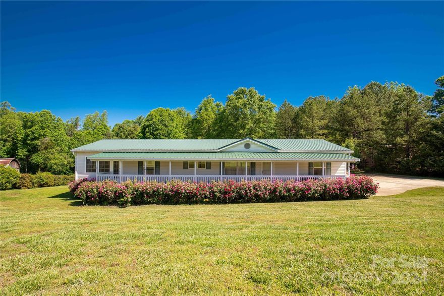 Welcome to this meticulously maintained mobile home nestled on just over an acre of serene land. Boasting three spacious bedrooms and two bathrooms, this charming residence offers comfortable living spaces for the whole family. A cozy retreat to relax or entertain guests, the heated sunroom addition provides year-round comfort and is a delightful feature to enhance the living space.   Rocking chair front porch and back decks feature composite decking boards, a durable and low-maintenance option that extends the entertainment space and provides the perfect spot for outdoor gatherings or quiet mornings with a cup of coffee. Enjoy the convenience of two outbuildings equipped with power, perfect for storage, workshops, or hobbies. With its tranquil surroundings and ample space, this property provides the ideal setting for peaceful living. Double roof, leaf guard gutters, radon detectors and more come together offering a blend of comfort, functionality, and style.