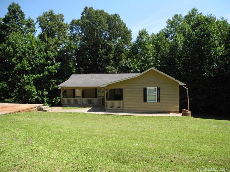 This is a great 1300+ sqft, home w/ basement. Total of 2616 sq ft! It isn't all cut up, you have a large spacious living room with a cathedral beamed ceiling, opening to the dining room & kitchen. Both bedrooms are spacious, bring that large furniture! You back up to a wooded area & you can hear the creek from your deck. The basement is a blank canvas, it also has a garage & fireplace down stairs! North Lincoln Schools & eligible for 100% financing! Less than 30 min to Charlotte or Mooresville.