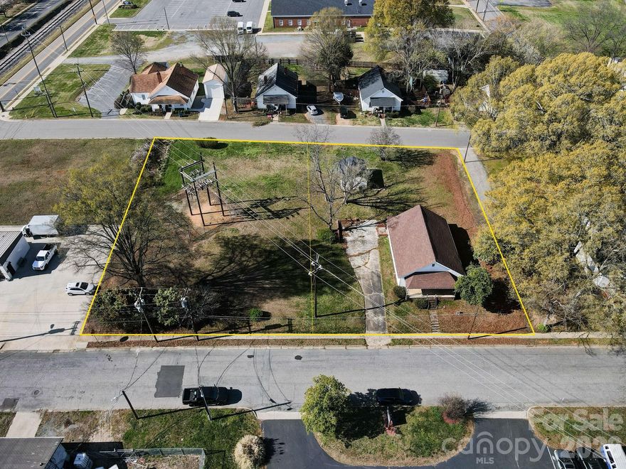 Unlock the potential of this 2 LOT Sale in the heart of Mooresville! This unique opportunity includes not only the home at 224 W Mills (Parcel #4656892787), but also the adjacent vacant lot at 215 Caldwell Avenue (Parcel #4656893760)—offering added space, flexibility, and investment upside. The house itself is a true blank slate, ready for your vision and creativity. Whether you're looking to renovate, redesign, or build something entirely new, this property provides the perfect canvas to bring your ideas to life. Ideally located just minutes from vibrant Downtown Mooresville, you’ll enjoy easy access to local shops, dining, night life and community events. Plus, you're just around the corner from the redesigned Moor Park, home of the Mooresville Spinners, making it a great spot to enjoy recreation and local baseball. Whether you're an investor, builder, or buyer looking for a project with upside, this combined property offering presents a rare chance to create something special in this location. Property Sold As-Is