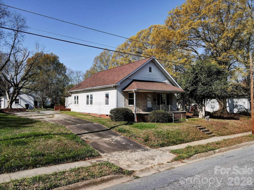 This is a rare opportunity to renovate a property in the heart of downtown Mooresville where much of the difficult early work has already been completed. New roof, old sheetrock and plaster removed and interior taken down to the studs.  Even better, the property includes professionally engineered and stamped renovation plans converting the home into a modern 3-bedroom, 2-bath open concept layout—saving both time and design costs for the next owner. The house itself is a true blank slate, ready for your vision and creativity.  Ideally located just minutes from vibrant Downtown Mooresville, you’ll enjoy easy access to local shops, dining, night life and community events. Plus, you're just around the corner from the redesigned Moor Park, home of the Mooresville Spinners, making it a great spot to enjoy recreation and local baseball. Whether you're an investor, builder, or buyer looking for a project with upside, this property offering presents a rare chance to create something special in this location. Property Sold As-Is