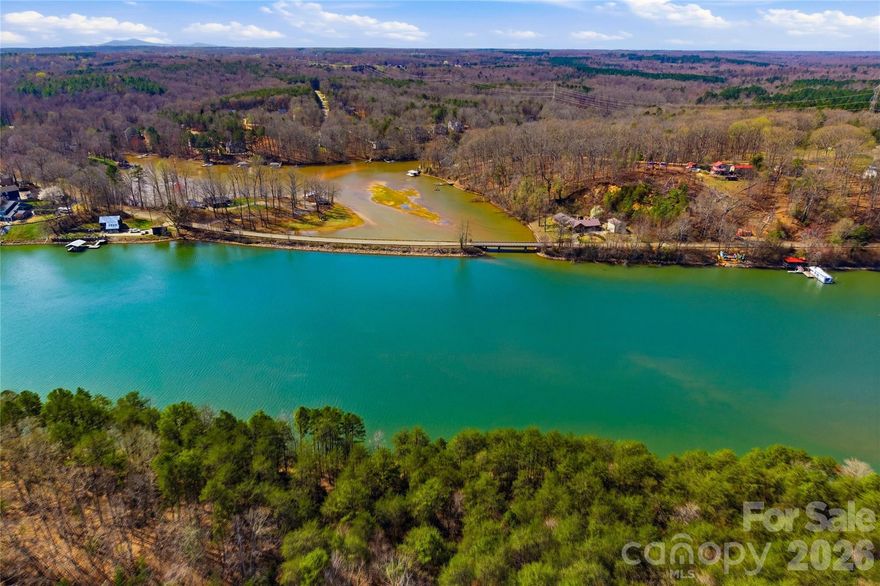 Build your custom home in the growing Long Bay community with this .82-acre homesite offering water access and long-term upside in an area with limited remaining inventory. Surrounded by new construction and ongoing development, this lot presents an opportunity for buyers looking to design and build in an established lake neighborhood.
The property features natural topography that allows for a thoughtfully designed custom build, with site planning and grading considerations typical for this area. Buyers should plan for standard site preparation based on their specific home design and placement preferences.
Enjoy the potential for water access and the benefits of a community that continues to see steady growth and new home construction. Whether you’re looking to build now or invest in a homesite in a developing neighborhood, this property offers strong long-term value.