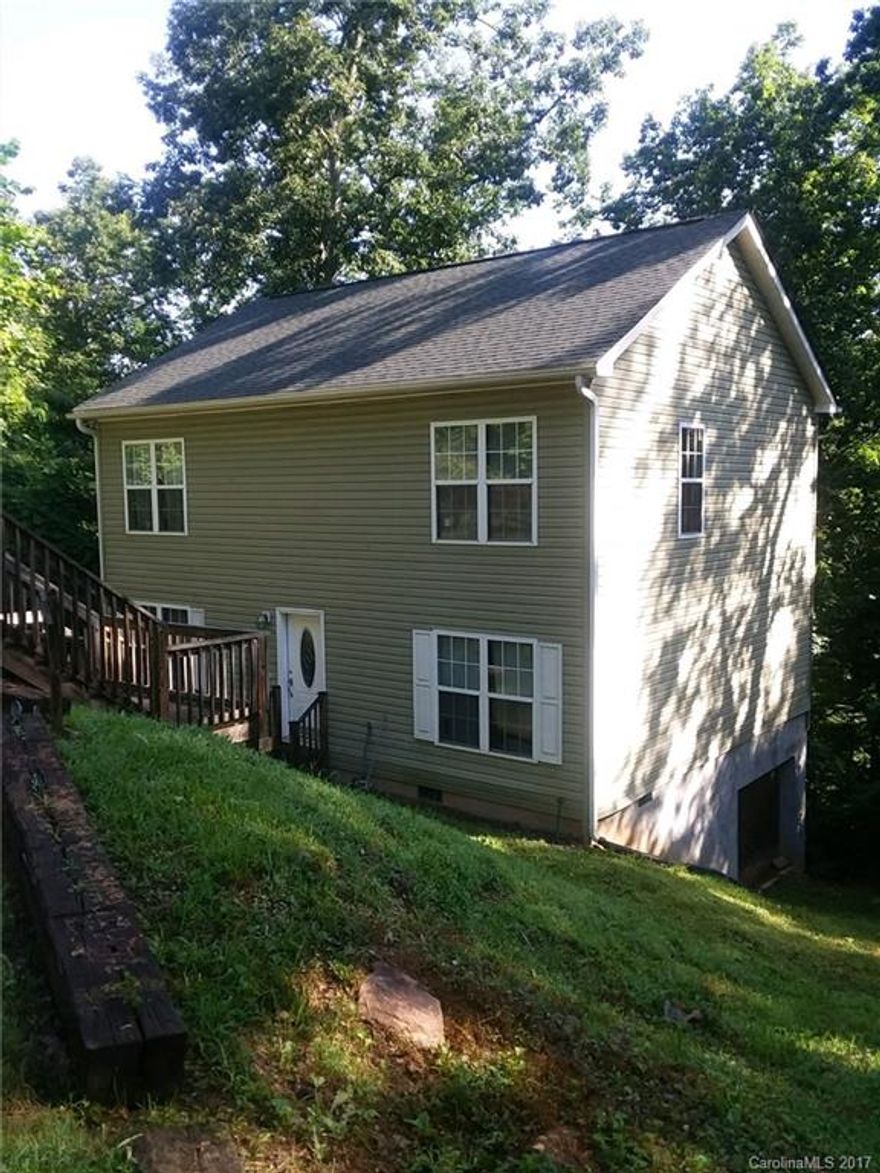 Nice home close to town with lots of space for a family with three large bedrooms, each with it's own full bath.  There is also a bonus room upstairs between the two bedrooms, which would make a great "children's den".   Home is in a nice small neighborhood, close to Tryon Elementary school.  Affordable living within walking distance to town.  Great starter home or investment property