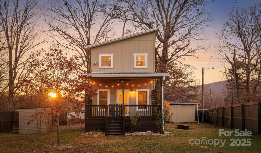 Charming 2-bedroom, 2- bath Compact Cottage in Asheville. This well-maintained home features bamboo flooring throughout the main level and pine flooring upstairs.  At the top of the stairs a versatile sitting or office nook includes a built-in bookcase. Recent updates include a new Mitsubishi mini split system, stove and gutters. Home also offers a natural gas water heater for efficiency utility performance. The exterior is made of composite wood. The fully fenced 0.15-acre lot provides privacy and outdoor enjoyment with raised flower beds ready for plating. A thoughtfully designed property in a convenient Asheville location, perfect for low maintenance living with character.