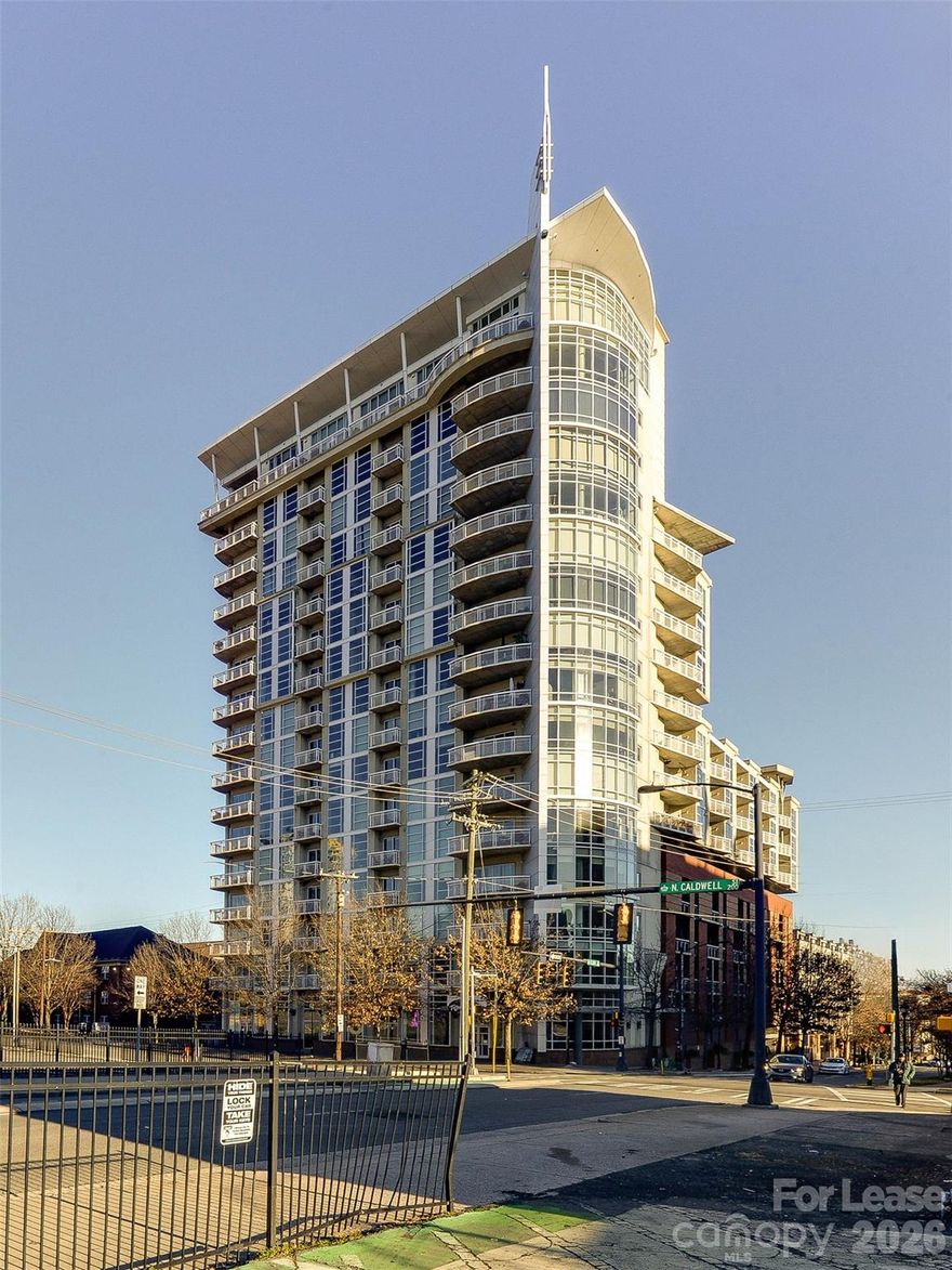 Excellent and newly renovated Uptown 8th floor condo in the Courtside complex.  Live in the heart of it all and be seconds to nightlife, great restaurants, dining, shopping and parks.  Across the street is the Spectrum center for events and concerts.  Take the secure entry elevator up to the 8th floor to get to this beautiful condo.  Hardwood floors, new carpet and custom finishes make this home shine.  The large bathroom and walk in closet are sure to please.  All appliances plus washer/dryer are included in the rent.  Enjoy the long range views out of the wall of windows leading to the large patio looking towards NoDa.  One secure parking spot is included too!  The building features a great location and a large roof top patio for entertaining.  Take a look today!