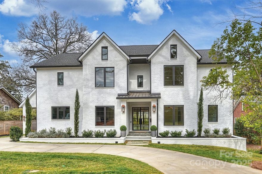 Stunning steel/glass dbl doors welcome guests. Accordion sliding doors bring the outside in for indoor/outdoor living spaces. 953 sq ft covered porch overlooking the saltwater pool includes outdoor kitchen/dining area, fireplace, ceiling mounted infrared heaters & TV/entertainment setup. The kitchen has an Italian Monogram appl pkg (60” frig/frzr, a 48” gas range). The scullery connects the indoor & outdoor kitchens/dining areas making entertaining a breeze! Formal dining area features floor to ceiling windows overlooking the pool. Multiple work from home options w/ a private ofc, command ctr, plus finished space over the garage. Primary ste & guest ste on main. The 2nd floor has a large media room w/ a wet bar (TV stays!), a bonus room w/ built ins and 3 oversized bedrooms, each w/ an en ste bath. A 1/2 bath on that flr completes the ease of entertaining. The porte cochere has a side entrance & leads to an oversized garage w/ finished ste above incl kitchenette. The driveway is gated.
