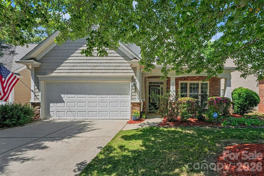 LAWSON | Lawn Maintenance Included | Cuthbertson Schools
Welcome to this beautifully maintained home in the highly desirable Lawson community in Waxhaw.
A rare and functional floor plan features a spacious primary bedroom suite on the main level overlooking the private backyard, along with a second main-level bedroom with full bath access — ideal for guests or a home office. The open layout is perfect for everyday living and entertaining, highlighted by a dramatic two-story great room with gas fireplace that flows seamlessly into the kitchen and sunroom. The kitchen offers granite countertops, center island, stainless steel appliances, pantry, and casual dining area. Hardwoods throughout much of the main level add warmth and character. Upstairs includes a third bedroom with walk-in closet and full bath, plus a versatile loft with walk-in storage. Enjoy the oversized rear deck, charming front porch, and quiet cul-de-sac location. Lawson offers exceptional amenities including pools, clubhouse, fitness center, tennis courts, nature trails, playgrounds, sidewalks, and street lights — all minutes from shopping, dining, and historic downtown Waxhaw. A wonderful opportunity in one of Waxhaw’s most established, amenity-rich communities.