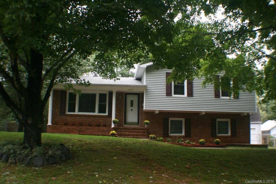 Move in ready south Charlotte home. Close to light rail. Well maintained home with many upgrades. Has 4 lg bedrooms, 2 full baths. Kitchen has new granite count tops and back splash, fridge conveys. New paint, updated bath and large private fenced backyard. Original hardwoods under carpet on top two floors. Huge additional two story insulated and wired building with large workshop on one side and garage that will hold 3 cars on the other, plus plenty of additional storage on second floor.