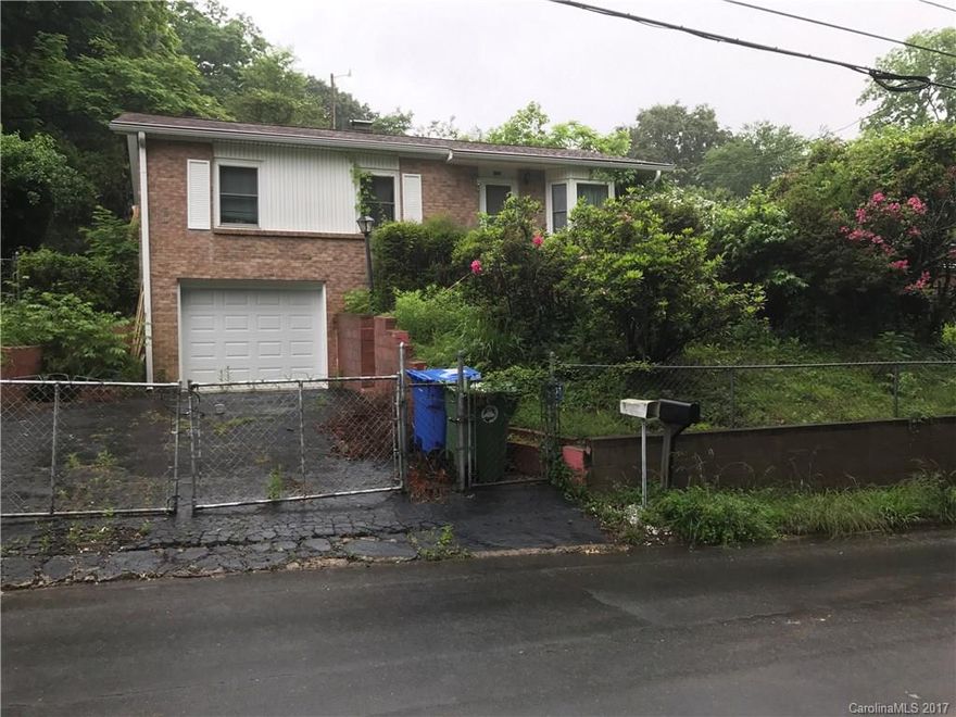Walking distance to Haywood Road! This home has solid bones and is just waiting for a new owner with a vision for interior remodeling. INVESTOR/HANDYMAN SPECIAL - this home is being sold in "as is" condition. Adjacent building lot, recently surveyed off from original parcel, also for sale (MLS: 3284289). 
**Per court order, listing must be active for 30 days before seller can consider offers. Accordingly, seller will begin reviewing offers on June 22, 2017.