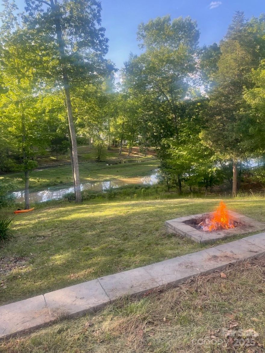 Great opportunity to own this beautiful property with private lake access from the comfort of your own backyard. This exceptional brick home in the heart of Lake Wylie offers lakeside living & serene lake views comes equipped with a generous walk-out finished basement with an in-law w/separate entrance—perfect for guests or extended family looking for privacy and comfort. The airy open floor plan features a formal dining, home office & vaulted living room w/ stone fireplace. Gourmet chef kitchen is perfect for gatherings & entertaining. Main & 2nd floors have been totally freshly painted. Newer HVAC, tankless water heater, plantation shutters, trex stairs deck, newer main kitchen appliances & windows. Fully fenced in leveled backyard has plenty of a room for a pool.  Embrace the beauty of lake lifestyle living minutes from shopping, parks, trails & Downtown Charlotte. Low SC taxes, community boat storage & pool, great location & Clover schools are a BIG plus!
