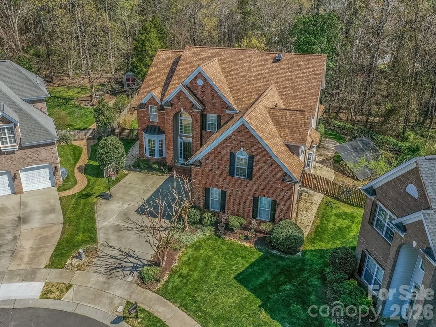 Don't miss your opportunity to own in one of Ballantyne's Premiere Communities of Providence Pointe.  This amazing cul-de-sac lot is one of the largest in the community, is fenced, & is completely private! The entire interior has been freshly painted and is move-in ready!  The floorplan is fantastic with dramatic 2 story foyer that flows into the formal dining room & formal living room that has vaulted ceiling!  The great room & kitchen are perfect for entertaining & the kitchen boasts granite countertops, breakfast bar & island.  The great room has gas log fireplace & has access to the spectacular screened porch where you will spend most of your time!  The main floor also features a guest bedroom with access to a full bath.  The oversized primary suite is on the 2nd floor & has a large primary bath with dual vanity, walk-in shower, garden tub, & large walk-in closet.  The 2 guest rooms are also spacious & have access to a large guest bath.  There is also a large bonus room that is perfect for a home theatre, game room, or possibly a 5th bedroom.  The home also features solar panels that are adjacent to the home & fully paid for.  As a new owner you will enjoy all of the benefits of free energy & none of the costs!  The more than 1/2 acre lot backs up to lots of wooded space & has a lovely garden ready for Spring Planting.  Providence Pointe has an unparalleled community amenity with clubhouse, pool, slide, splashpad, playground, tennis courts, & sport court!  All located conveniently to all that Ballantyne has to offer!  Make this your next home today!