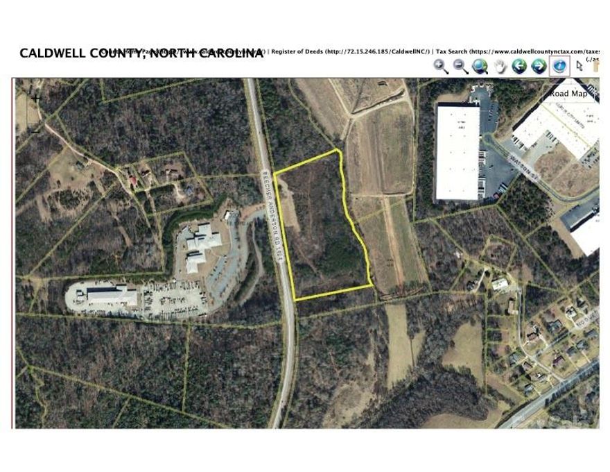 Prime development opportunity--12.85 acres in growing Western NC market.  Exceptional undeveloped parcel, perfectly positioned in scenic Western North Carolina Foothills.  Rare combination of rural tranquility and commercial  potential.  Ideal investment property.  Approx. 1/2 mile from US Hwy 18 (Morganton Blvd, 18,000-20,000 vehicles/day).  Beecher Anderson Road is a manageable 2000 vehicles/day.  Excellent accessibility to major transportation corridors.  Zoned Commercial/Industrial but local planning department open to rezoning request.  Site perfect for commercial or multiple low-density residential homesites.  Beautiful rural setting in low density surroundings.  Utilities and infrastructure in place.  Water meter on site.  Sewer line within feet of property line if septic permit not desired.  Eastern property line bordered by stream with low lying corresponding floodplain contiguous to beautiful agricultural lands.