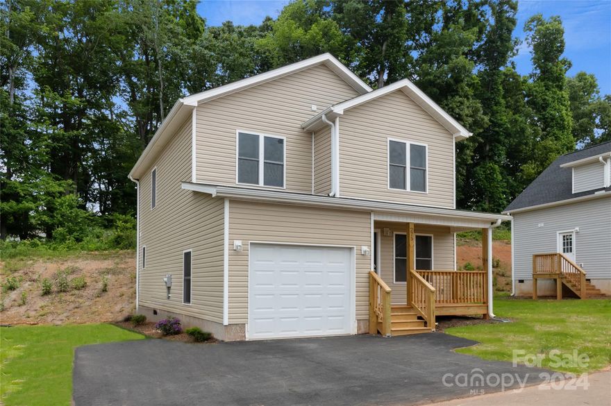 Escape the traffic come be a part of small town life just 20 minutes to downtown Asheville. New construction in  conveniently located new home community in Mars Hill. This site built home offers open floor plan, luxury waterproof vinyl plank flooring throughout, granite counter tops, stainless appliances, 2x6 exterior walls, and a front porch perfect for rocking chairs.  The community offers paved roads, high speed fiber optic internet, green space and all city services, including water/sewer, free trash pickup and free curbside recycling. Close to schools, restaurants and shopping. Homes are USDA and VA approved.  Taxes to be determined. Photos are representative.
