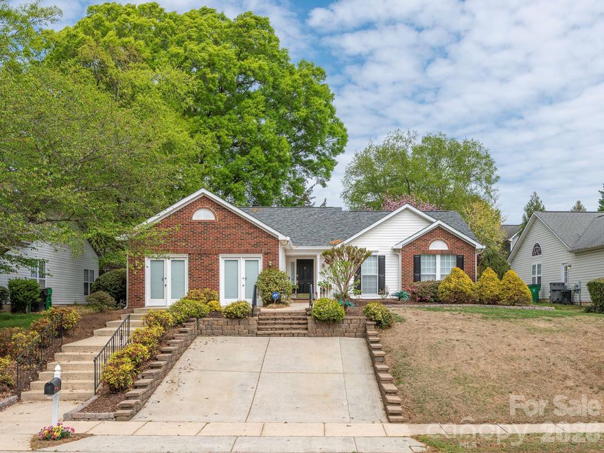 *Former Model Home for Farmington neighborhood!* This meticulously maintained ranch style, one story property blends premium builder upgrades with significant recent capital improvements. Rest easy knowing the "big-ticket" items are handled: a brand-new roof (June 2025), a new water heater and whole-house water softener (January 2026), and LeafGuard gutters for maintenance-free living.

The interior showcases elegant crown molding and the seamless flow of hardwood floors throughout—completely carpet-free! Cleaning is effortless with the integrated central vacuum system. The primary suite boasts vaulted ceilings for a retreat-like feel, while the professionally converted garage serves as a climate-controlled flex space with French doors—perfect for a home office or gym. The kitchen features stainless steel appliances and quartz countertops. The home is also equipped with a pre-wired security network that includes, window/door contacts and motion sensors. Ready for immediate activation. 

Outdoors, the manicured, fully fenced backyard features a patio with a custom awning and a 10x12 storage shed. Nestled in a quiet enclave with unbeatable access to I-77 and I-85, you are less than 15 minutes from UNCC, Atrium Health, the LYNX Blue Line, Northlake Mall, and the Wells Fargo CIC.

Experience the perfect balance of suburban tranquility and urban accessibility in a home that was literally designed to be the neighborhood's showpiece. Schedule your showing today! Some images are virtually staged.