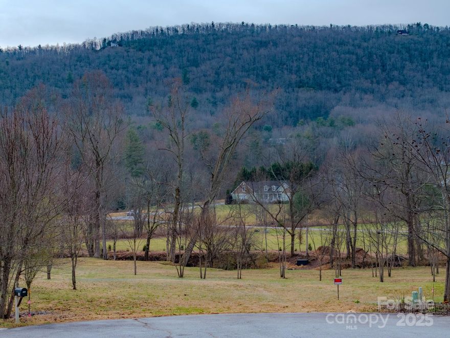 Lot 5 in Red Maple Farms is a unique 1.5-acre property located between Hendersonville and Brevard. It’s just 7 minutes from Jeter Mountain Farms, 10 minutes from DuPont State Forest, 20 minutes from the entrance to Pisgah National Forest, and 30 minutes from the Asheville Regional Airport. The southern boundary includes more than 400 feet of year-round waterfront along Mud Creek, and access is easy via the private paved road, Walnut Valley Lane, directly off Walnut Cove Road.

The lot is cleared and ready for your build, offering wide, year-round mountain views from nearly every point. Power and wired AT&T internet are already available at the property; a well, septic system, and propane will need to be installed. While the property is part of a planned community, there is no active HOA.

Call today for more information or to schedule your showing!