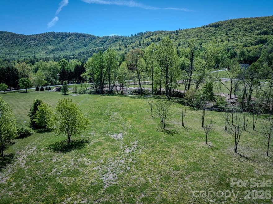 Lot 5 in Red Maple Farms is a unique 1.5-acre property located between Hendersonville and Brevard. It’s just 7 minutes from Jeter Mountain Farms, 10 minutes from DuPont State Forest, 20 minutes from the entrance to Pisgah National Forest, and 30 minutes from the Asheville Regional Airport. The southern boundary includes more than 400 feet of year-round waterfront along Mud Creek, and access is easy via the private paved road, Walnut Valley Lane, directly off Walnut Cove Road.

The lot is cleared and ready for your build, offering wide, year-round mountain views from nearly every point. Power and wired AT&T internet are already available at the property; a well, septic system, and propane will need to be installed. While the property is part of a planned community, there is no active HOA.

Call today for more information or to schedule your showing!