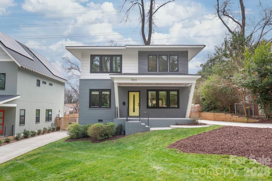 Welcome to 1933 St Paul in the heart of the rapidly growing Lincoln Heights community in Charlotte. Built in 2022, this 4-bedroom, 2.5-bath home offers approximately 2,100 square feet of thoughtfully designed living space with a striking modern front elevation and contemporary finishes throughout. Inside, you’ll find site finished hardwood floors flowing seamlessly across the entire home, complemented by tile flooring in all bathrooms. The open-concept main level is anchored by a beautifully connected kitchen, dining, and living area perfect for entertaining or everyday living. Incredible natural light fills the space, highlighting clean lines and elevated design details. The main level features a spacious primary suite offering comfort and privacy, along with a versatile fourth bedroom ideal for a home office. Upstairs, a generous loft provides flexible living space, accompanied by two additional bedrooms, a full bath, and a dedicated gym area. Situated at the end of a quiet dead-end street, this property offers exceptional privacy and a large, usable backyard with plenty of room to relax, play, or entertain. From the rear second floor windows, enjoy select views of Uptown, adding a subtle urban backdrop to this peaceful setting. Conveniently located with quick access to I-77 and Uptown, this home blends modern design, functional layout, and prime location into one exceptional opportunity.