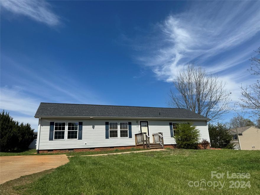 Beautiful three bedroom, two bath modular home in Newton offers so many upgrades! Fabulous open floor plan throughout the main portion of the house offers LVP flooring and a spacious kitchen, connecting to the large laundry/utility room. Primary bedroom offers beautifully upgraded en suite bathroom with double sinks. Additional two bedrooms, a full bathroom, and bonus room with a wood burning fireplace are situated on the opposite side of the home. Large two level deck out back and a storage building, available for tenant use. All situated on a prime corner lot. Small dogs only, please.