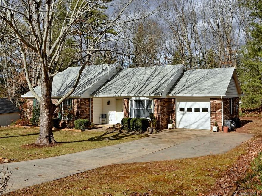 AFFORDABLE & MOVE-IN READY! All-brick rancher has hardwood & tile floors, cathedral ceiling with skylight and gas fire logs in living room. Updated kitchen: new refrigerator with freezer drawer, gas range, new DW, new microwave, new tile floors and splash, etc. New gas HWH  and 11+yr roof.  Large private gently rolling wooded backyard with  shed. GREAT CUL-DE-SAC LOCATION - near Stoney Knob Cafe -- Weaverville and North Asheville! WON'T LAST LONG!
