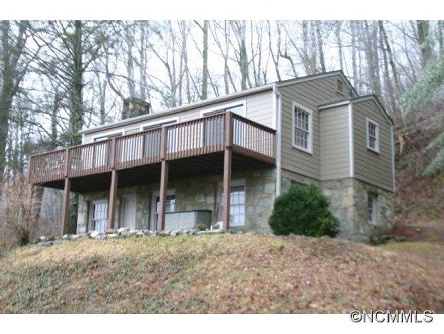 IMMACULATE 1950's style mountain cottage with knotty pine interior, hardwood floors and 2 large stone fireplaces. Lower level features a large master suite with stone fireplace. Common area includes a picnic area, fishing pond, etc. A MUST SEE! Comes fully furnished at $169,900!