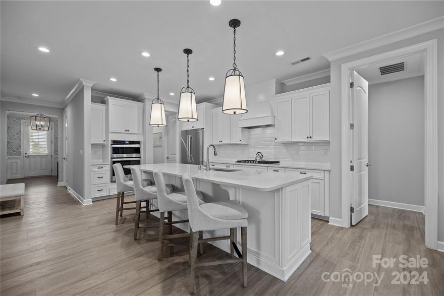 Taking Back up offers! Beautifully maintained 3-bedroom,3.5-bathroom home featuring numerous upgrades.This stunning property boasts a modern open floor plan,gourmet kitchen with stainless steel appliances, spacious living areas,and elegant finishes throughout.Each bedroom offers ample space and privacy, including a luxurious master suite with a spa-like bathroom.This charming ranch has a large loft,full bedroom and full bathroom upstairs.Upgrades include upgraded bathrooms, porch shades and lovely plantation shutters.Enjoy outdoor living with a manageable yard,screened in back porch and private patio.Upgrades include:under cabinet lighting,plantation shutters,extended paver patio,screened-in porch,stair treads,upgraded bathroom countertops and walk-in shower,light fixtures and ceiling fans,air blower for fireplace, and automated 12' awning out back