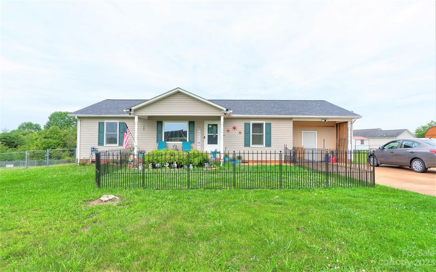 3 br 2 bath vinyl ranch home on approx .792 acre lot in Stoneridge s/d in Boiling Springs ETJ area of Cleveland County. Home is built with an open floor/split bedroom plan & has neutral colors throughout. Dining Room has French doors to the rear deck. Primary Bedroom has a walk-in closet. Bedroom 3 is large & has a huge walk-in closet. The home has a covered front porch. The large rear deck is a great place for entertaining or just relaxing. The large back yard is partially fenced. The carport has been enclosed for extra storage. Per the seller, the shutters & flooring are new, the refrigerator & stove are newer, the roof was installed in April 2023 & the new windows were installed in May 2023. The refrigerator, washer & dryer all remain. The storage building remains. There are extra parking pads beside the driveway for extra parking.