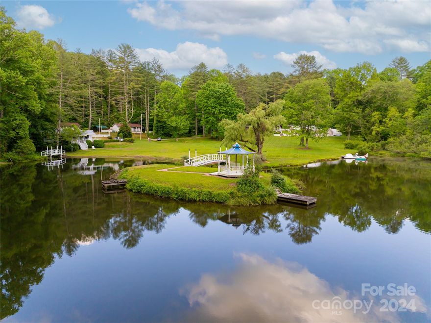 Welcome to beautiful 13 acre Rainbow Lake. Nestled in a valley 15m from dtown Brevard along the trophy trout waters of the East Fork. Consisting of 12 (11 residences, 1 maintenance bldg) structures on a private 3-acre lake. All homes have high-efficiency central heat pumps & mini-splits. Rainbow lake is fed by 3 streams, one from a large watershed & two from nearby springs, which empties over a 14-ft waterfall that flows into the East Fork (Walkable from property) of the French Broad River. The resort is a 35m drive to Avl airport, 60m from dtown Asheville. Rainbow Lake & The East Fork are regularly stocked & is designated trout trophy waters. Presently, the 1,000 sq.ft. pavilion can be utilized as a reception, presentation, or education center w parking for 80 vehicles, storage shed & food prep area. Additional land on the ridge for expansion. Great potential for Vacation rentals, ed. center, family compound, private community, retreat/seminar center, vacation resort, & more.