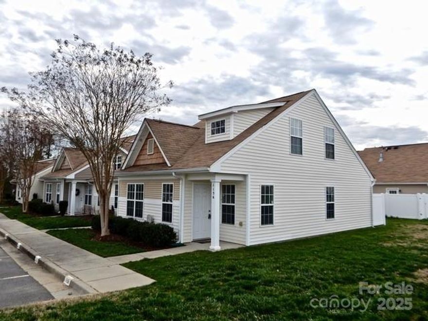 Quaint 2-Story End Unit Townhome in growing Indian Land. Open feel  with open floor plan with new LVP Flooring for easy upkeep on the main level ...allows the living area to flow right into the kitchen. Dining area between the living area and kitchen. Kitchen features smooth surface countertops, bar seating, tile backsplash, and a pantry. 2 bedrooms and full bath on main level. Spacious laundry room on the main. Primary suite completes the second level. Primary bathroom with a shower/tub combo with single sink vanity. Enjoy the screened in porch year round!  This home will be near the new Target and Costco locations in Indian Land. Close to schools, shopping and transportation corridors.