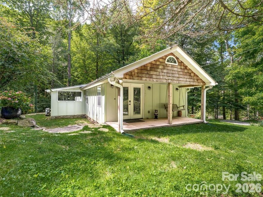 Creekside Retreat – A Mountain Home With Heart and RV Hookup!

Imagine waking up to the sound of rushing water, stepping out onto your screened porch, and sipping coffee as the morning sun dances across the creek. Creekside Retreat isn’t just a home—it’s an experience.  With hardwood floors, and large windows flooding the space with light, this thoughtfully updated 2 bedroom 2 bathroom cabin blends modern comfort with mountain charm. The upgraded kitchen with granite counters and warm wood cabinetry is perfect for laughter-filled dinners and cozy nights in. Spend your days exploring your own private property, dipping your toes in the creek, or winding down around the fire pit under a blanket of stars. Inside, the family room invites comfortable evenings together, while outside offers peaceful nooks for solitude. And when adventure calls? You’re only minutes from vibrant Weaverville, Asheville, the Land of Waterfalls, and endless mountain trails, restaurants and activities. Best of all, paved year-round access means you can get here with ease—no special vehicle required. Own this as a second home with as little as 10% down; use rental revenue to offset the cost of owning YOUR very own vacation home.  Managed by Yonder Luxury Vacation Rentals...and guess what is included? So many 5 star reviews! Rental data available upon request. Whether you’re seeking a forever home, a family getaway, or a sanctuary to recharge, Creekside Retreat is ready to welcome you home.