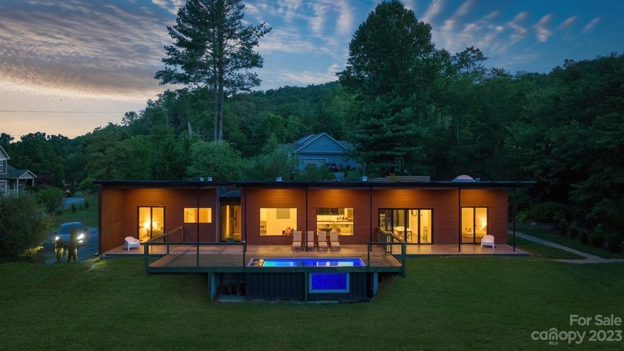 Discover the epitome of eclectic custom design in this architectural masterpiece. The steel, wood, and bark exterior elements seamlessly blend with stunning glass architecture, creating a truly unique retreat. Enjoy a refreshing pool, the convenience of an EV charger, and the serenity of surrounding pasturelands. The spaces are open and unpartitioned, creating a spacious and well-lit environment with beautiful views of nearby mountains. The kitchen features custom solid surface countertops and high-end cabinetry. A notable architectural feature is the presence of two opposing accordion-style glass doors in the dining area. These doors create an open and airy atmosphere, effectively connecting the indoor and outdoor spaces. Not only brings the beauty of the outdoors inside but also allows for a seamless entertaining. The home is managed by a national, luxury hospitality company, and includes an option to purchase the home as a turnkey STR while while leaving management in-place.