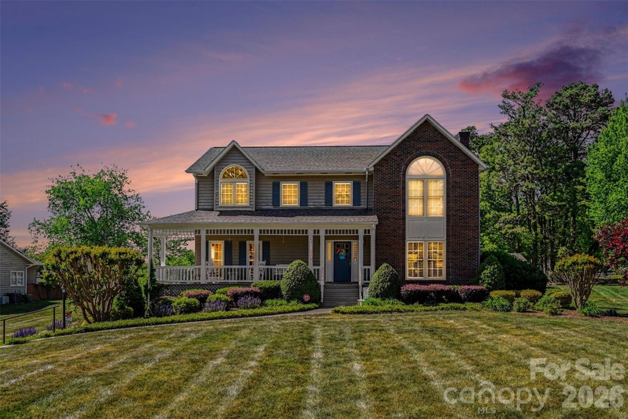 Welcome to Catawba Springs and a lovely one owner home which has been meticulously maintained! This charming 4-bedroom, 2.5 bath custom home offers modern updates, crown molding, spacious design, and great location overlooking hole #8 on the Fox Run course. Enjoy the serenity as you swing on the front porch overlooking lush mature landscaping. As you enter the front foyer, step into the elegant great room, featuring a cozy gas log fireplace, built-in cabinets and sliding door leading to a covered and screened 16'x 16' back deck. Just beside it, is an uncovered deck with a recessed hot tub for ease of entry and steps leading down to the yard. Just off the great room is a large kitchen with eat at bar, granite countertops, abundant cabinets, and a small built-in writing desk. Just off the kitchen is a formal dining room, laundry room w/pantry and 1/2 bath. Upstairs offers an expansive primary suite and an ensuite with dual vanities, a walk-in tile shower, stand-alone soaking tub and large walk-in closet. Down the hall are 3 guest bedrooms and a guest bath with walk in shower. In the basement, is a huge, finished rec room with pool/ping pong table. The other side features a two-car garage with storage area.
