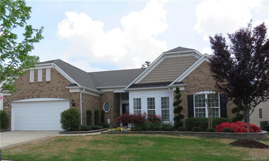 LOCATION - PRIVACY - TONS OF UPGRADES - 3-season porch. paver patio w/fire pit. private, wooded yard w/seasonal lake view. professionally landscaped.5-zone sprinkler system. walk to amenities.Gourmet Kit. granite countertops. pull-outs in kit cabs. under/over cab lights. custom pantry. tray ceiling in MBR.granite in master bath. jetted tub.custom closet system. 3" hickory distressed hardwoods. extensive moldings.extended gar. 8x16 attic storage w/versa lift.high efficiency furnace.2 attic fans.