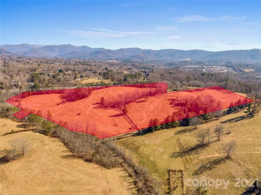 Rare development opportunity located less than 1 mile from major commercial hub (Walmart & Lowe’s) in Weaverville, NC. Weaverville continues to show rapid economic and population growth bolstered by a unique mix of small town mountain charm with larger scale infrastructure and easy access to Asheville. 28.36+/- acres of gentle lying land, mostly cleared acreage, encompassed by mountain views and currently zoned for residential medium density. Plenty of sewer capacity for a large development, including gravity fed sewer. Additional adjoining acreage is publicly marketed for sale. The entrance to Gill Branch Rd has 5,600 VPD and is located within approx. 0.4 miles to US-25/US-70(18,000 VPD) and 1.7 miles to I-26 Exit 19 (50,500 VPD). 1,314 ft of interstate road frontage. Minor portion of the property, along Gill Branch Creek, is located in the 100 year floodplain. Property requires extension of ROW or additional access via separately owned parcel to facilitate higher density development.