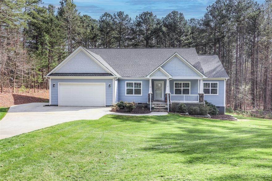 This stunning house is perfect for anyone looking for spacious & comfortable living space. As you enter the home, you'll be greeted by an open floor plan w/plenty of natural light throughout the living area, dining area & kitchen. The layout is perfect for gatherings. The kitchen has plenty of cabinet space for storage & a pantry. The bedrooms are all generously sized. The primary bedroom features an en-suite w/double vanity & walk-in closet. The two additional bedrooms share a bathroom & offer plenty of space for guests. There is a designated Office w/french doors. The formal Living Room could also be used as a formal Dining Room. One of the unique features of this property is the Community Lake Access through a Path in the Back of the House! Just launch your canoe or kayak & spend your afternoon exploring the serene lake. Don't miss this home w/seasonal views & lake access. Tall crawlspace w/cement pad for storage. Interior & back deck recently painted. New carpet in primary bedroom.