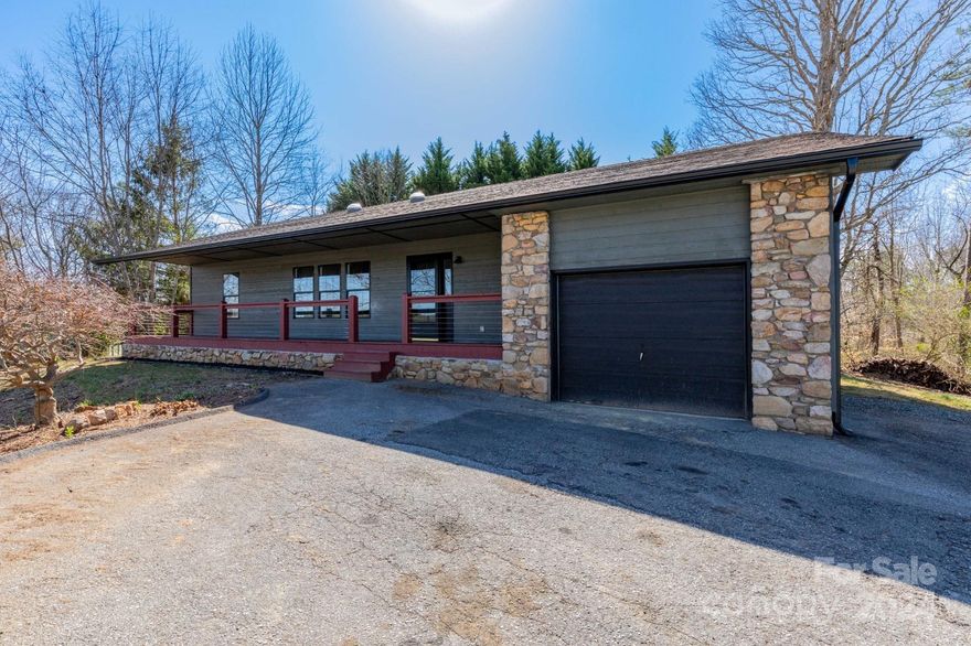 Immaculate home located in the desirable area of Weaverville.  This newly renovated ranch style, 3 bedroom, 2 bath home offers easy access to I40.  The kitchen complete with refurbished cabinets, granite countertops, and large island will provide you with lots of entertainment opportunities.  A split bedroom plan with bathrooms that have also been updated.  Sit on the large back deck off of the dining room and enjoy your own peaceful oasis.  A fence expands around the back area of home. The home sits on a knoll, you will enjoy sitting on the covered front porch looking at the great mountain views on both sides of the home. Come see the comfort, style, and location and create you own lasting memories.  3 miles to downtown Weaverville and less than 20 minutes to downtown Asheville.