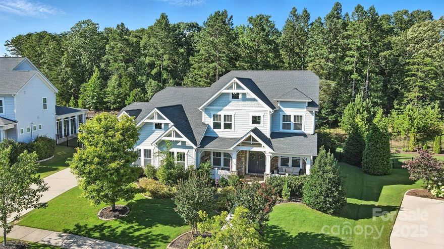 Stunning 5-bed, 4-bath Aurora plan by Fielding Homes in the sought-after Masons Bend community of Fort Mill! This impeccably designed home backs to a wooded preserve and features covered front and back porches, perfect for relaxing or entertaining. Inside, the main level offers a luxurious primary suite with en-suite bath and a guest suite, ideal for visitors or multi-gen living. The open-concept living area connects the gorgeous gourmet kitchen, morning room, and family room, creating a seamless flow. Upstairs you'll find three additional bedrooms, two full baths, and a large loft, perfect for a media room, office, or play space. With a 3 car garage, designer finishes, high ceilings, and plenty of natural light, this home offers comfort and style. Enjoy award winning schools and incredible amenities like a resort style clubhouse and pool, trails, playgrounds, and more! Don’t miss your opportunity to own this exceptional Aurora plan, where thoughtful design meets everyday luxury!