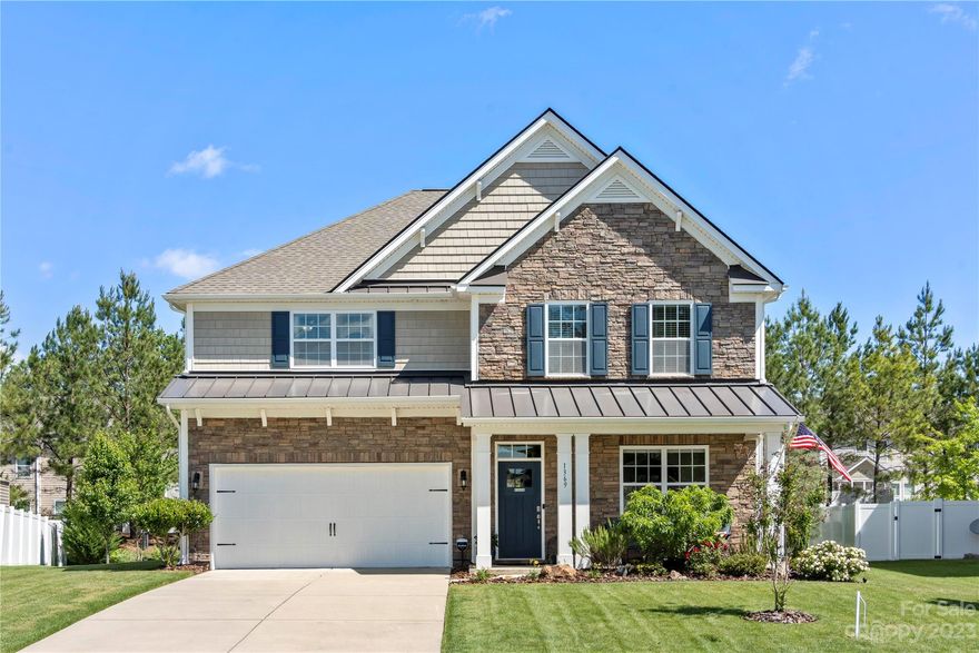 Beautiful 5-bedroom home! A spacious plan gives you all room you need. First, you will see the meticulously maintained lawn, lovingly landscaped where the owner has spared no detail in their arrangement of plants, flowers, & trees. Come inside, and fall in love with this beautifully finished home. LVP flooring throughout the main level/stairs. Enjoy the chef’s kitchen, entertain in the spacious dining room, or take your party outside. You will love the pavilion-covered patio, an outdoor space worthy to share with friends & neighbors. Your guests with feel at home with this main-level full guest suite & full bath. The owner has fitted this home with fine finishes throughout; granite c-tops, decorator paint, premium ceiling fan fixtures, & upgraded storage solutions.  On the upper level, the smartly laid out plan offers a sizable primary room, primary bath, & WIC, as well as 3 additional bedrooms & 2 full baths. The laundry is perfectly equipped with a folding counter and ample storage.