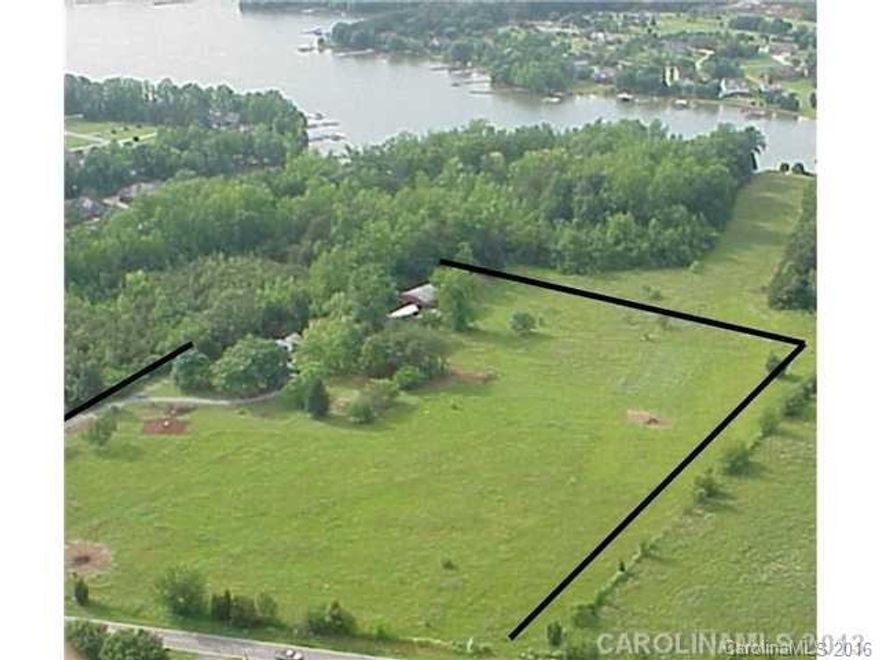 LOCATION, LOCATION, LOCATION!!! Prime LOCATION it IS!! Attention investors, developers and future buyers, VALUE is in the LAND & Location! Currently zoned R2 ( lots of opportunities ), buyer to hold for future development or start to build NOW~! Over 550 +/- Ft of road frontage. Property located off Exit 31 @ the Langtree exit! A few miles to LOWE's Corporate headquarters. HOUSE IS usable but the VALUE is in the LAND & LOCATION!