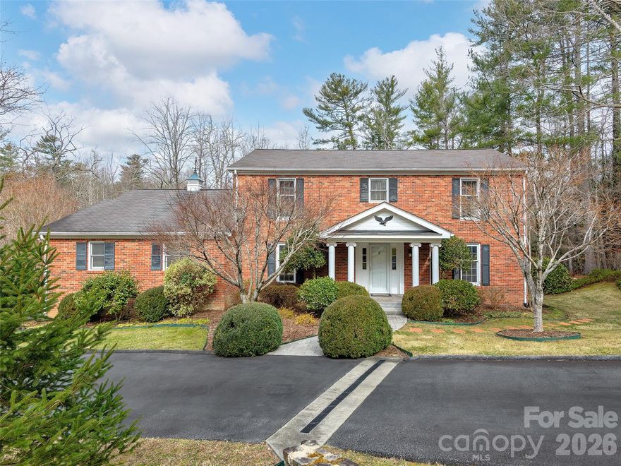 Classic Southern charm meets timeless elegance in this traditional two-story brick home, ideally located in the heart of historic Flat Rock. A gracious, curved staircase sets the tone as you enter the spacious foyer, instantly conveying the warmth and character found throughout the home.
Situated on a large corner lot, the property is framed by beautifully established landscaping that will truly shine as the seasons unfold. Inside, a completely renovated, sleek kitchen blends modern style with everyday functionality—featuring new cabinetry, quartz countertops, a gas cooktop, and a generous eat-in area with sliding glass doors leading to a covered porch, perfect for grilling and outdoor dining.
Original oak hardwood floors remain in excellent condition and anchor the home’s classic appeal. Oversized living spaces—including a formal dining room, living room, and a comfortable family room with a gas fireplace—offer ample room for gatherings both large and small. Upstairs, four spacious bedrooms and updated bathrooms provide flexible options for family living or hosting guests.
Outdoor spaces abound, inviting you to relax and explore. Enjoy the covered porch off the kitchen, step down to a deck, or continue into the yard where a stone-paved area awaits—ideal for a future firepit. An enclosed gazebo tucked into the side yard offers a quiet retreat for reading or afternoon lemonade, while a storage shed in the corner of the lot is perfect for the avid gardener.
This is the first time this home has ever been offered for sale—an exceptional opportunity in an unbeatable location. Just minutes from Carl Sandburg National Historic Site, the Flat Rock Playhouse, and all that historic Flat Rock has to offer.
