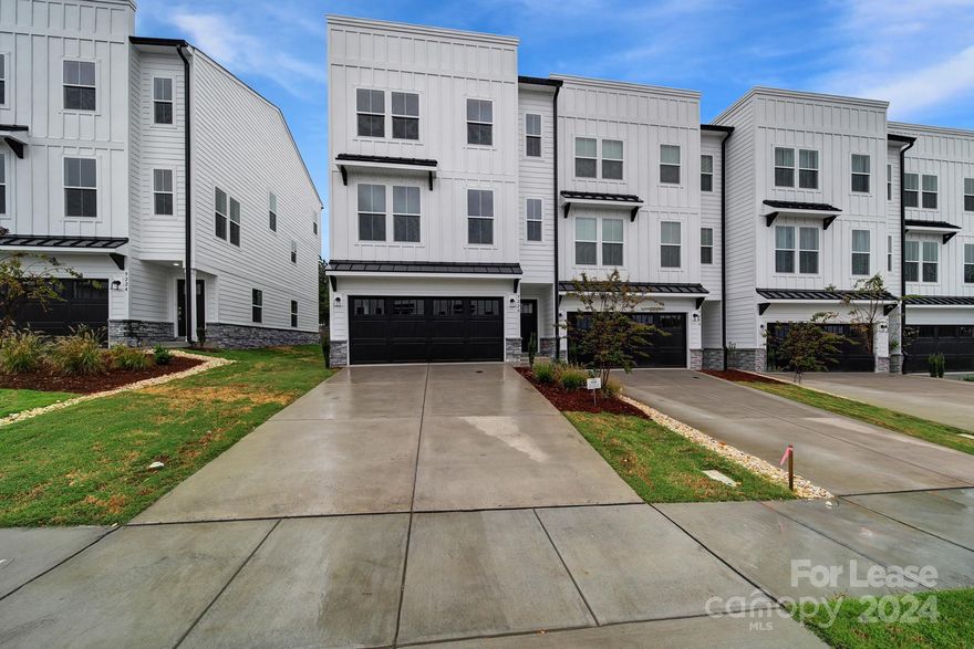 Introducing this gorgeous brand new townhome in Concord, conveniently located near Concord Mills. This stunning home features four bedrooms and three and half bathrooms, with a bedroom and full bath on the main floor for added convenience. The primary bedroom on the upper level boasts a lovely en suite bathroom and spacious closet. The spacious kitchen is equipped with granite counters, stainless steel appliances, and a large island with sink, perfect for entertaining guests. With a two-car garage and an electric car charger, parking is a breeze. Plus, the HOA takes care of landscaping, so you can enjoy a low-maintenance lifestyle. Please no pets.