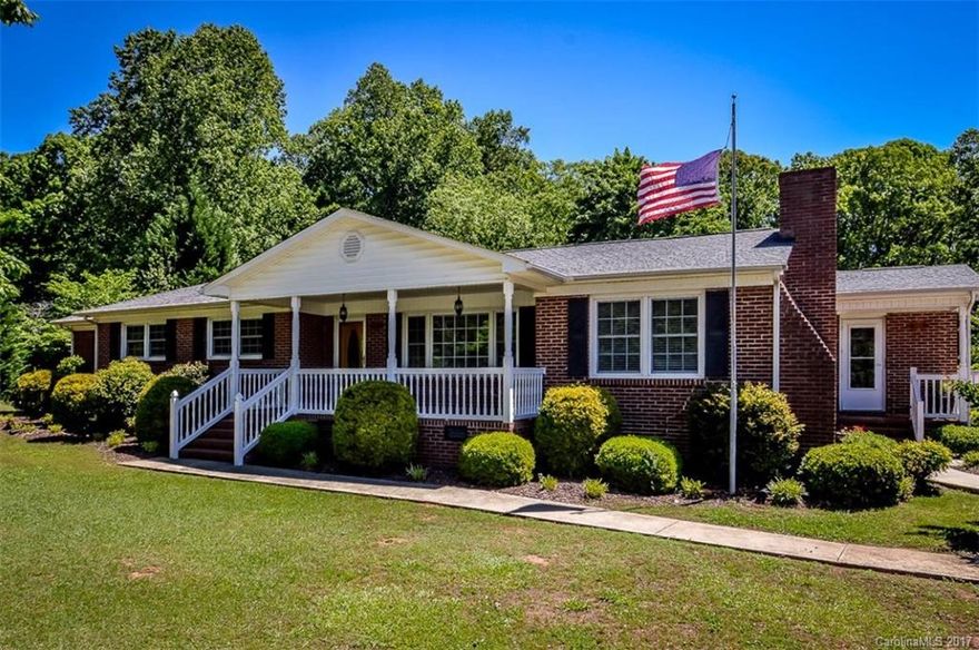 Beautiful, one-owner ranch home situated on one acre in Sharon, SC.  Master suite with separate tiled shower, large whirlpool tub and an expansive walk-in closet.  Hardwood and tile flooring throughout.   Home features separate sun room fully engulfed with tinted sliding doors, living room, den, dining room and three full baths.  Large covered front porch and wrap around deck and concrete patio area in the rear.  Storage closets galore! Wired workshop and separate storage building.