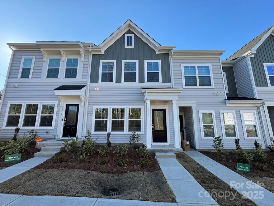 This Clover plan townhome is thoughtfully designed for today's lifestyle, offering three bedrooms, 2.5 baths, and an open, light-filled layout with upgraded designer touches throughout! The kitchen features Quill (light brown) maple cabinets, quartz countertops, White glossy backsplash, long sitting island for up to 5 chairs, stainless steel GE electric appliances, pendant lighting and luxury vinyl plank flooring throughout the main level. The upper level includes a boxed-ceiling primary suite with a walk-in closet and bath complete with dual vanities and a tiled walk-in shower. A nearby laundry closet for added convenience, two additional bedrooms, one of which has a desk-niche perfect for a office or desk setup, and a full bathroom complete the second floor. A rear-entry one-car garage and built-in bench and cubby system provide organization and charm. With tasteful finishes and a functional layout, this townhome perfectly balances style and practicality. Minutes from shopping, dining and entertainment! 2025 Parade of Homes GOLD Winner!