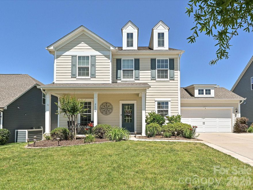 This beautifully upgraded 2019-built home in the desirable McCullough community offers the perfect blend of style, function, and convenience with easy access to both North and South Carolina. Featuring 4 bedrooms, 3 bathrooms, and soaring 10-foot ceilings on the main level, the home feels open, bright, and inviting from the moment you step inside.

The kitchen is a true centerpiece with beautiful finishes, generous space for gathering, and a layout designed for both everyday living and entertaining. Thoughtful improvements throughout the home add character and convenience while maintaining a clean, modern feel.

One of the standout features is the oversized garage — complete with epoxy floors, barn doors, and endless flexibility as a gym, workshop, hobby space, or additional storage area.

Outdoor living is just as impressive with a spacious patio that comfortably accommodates a dining table for six, plus an awning that creates the perfect shaded retreat for relaxing or entertaining year-round.

Residents of McCullough enjoy access to exceptional community amenities including pools, playgrounds, tennis and pickleball courts, scenic trails, and expansive shared green spaces that make it easy to enjoy the outdoors and connect with neighbors.