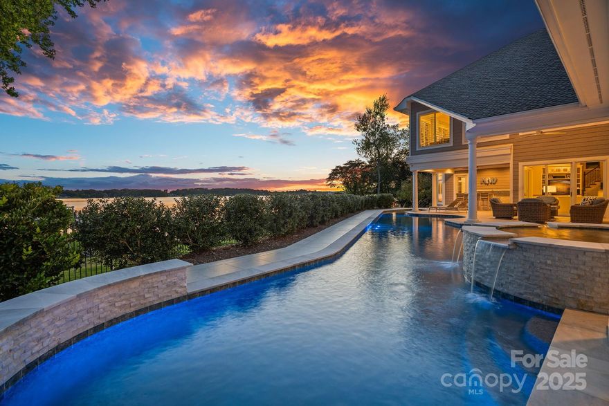 Luxurious Waterfront Retreat in The Point! Perfectly blending timeless elegance with contemporary design, this beautifully renovated Lake Norman residence offers sophisticated main-level living and sweeping, long-range water views from the moment you step inside. Spanning 5,887 square feet across two levels, this home features expansive yet inviting living spaces bathed in natural light, seamlessly connecting to outdoor entertaining areas designed for privacy and lakeside relaxation. Enjoy a resort-style saltwater pool with spa overlooking the lake, along with a newly renovated, maintenance-free private dock. The main level showcases a stunning, totally remodeled owner’s suite with white oak flooring & gorgeous spa retreat with heated tile flooring. In addition, the main level is complemented by two additional bedrooms with one that is currently serving as an office with exercise. The chef’s kitchen features a six burner gas range with griddle, center island with prep sink/ice maker and opens to a sunlit breakfast area or family room that leads to recreation/billiards room with bar—or step outside for grilling and entertaining poolside. Upstairs are two additional bedrooms, two full baths, a spacious recreation or media room, and a large flex space ideal for a spectacular lakefront office with built-ins plus generous walk-in attic storage. Centrally located within The Point, this home offers the convenience of a short golf cart ride to the club for dining or to enjoy the world-class amenities of Trump National Golf Club. With elegant main-level living and panoramic lake views from nearly every room, this home is a rare and refined offering in one of Lake Norman’s most sought-after communities.