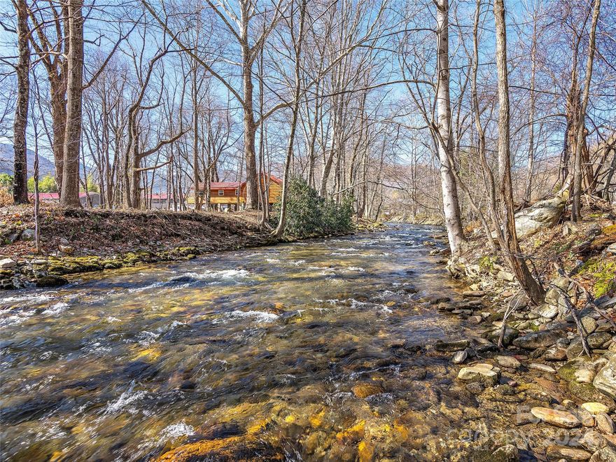 Discover an extraordinary & rare opportunity in the heart of Maggie Valley w/this 6.88 acre haven. Enjoy maximum creek frontage of pristine Soco Creek frontage, perfect for fishing & surrounded by gorgeous gentle laying topography with. The 3BD/1BA original family farmhouse with well and septic, an unfinished garage apartment w/ roughed-in electric & plumbing, shed. This versatile property is an ideal homestead, offering space for vacation rental fishing cabins, or fulfilling equestrian dreams w/room for stables & a riding ring. Located just minutes away from Cataloochee Ski Area, Blue Ridge Parkway, Harrah's Cherokee Casino, & Asheville, it presents an investor's paradise in a welcoming community. Take advantage of the proximity to restaurants & a brewery & embrace the endless possibilities this Maggie Valley gem offers.