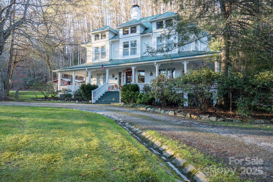 The Taylor House Inn ~ an important piece of Valle Crucis history and an iconic High Country property, brimming with storybook-like charm and offering potential for a number of uses. Nestled just down the street from the original Mast General Store and in close proximity to Valle Crucis Park and the Watauga River, this 3.9+ acre property offers a 7-bedroom/7.5-bath main home, 2 bedroom/2 bath guest home, additional guest cottage, storage & multi-use building, and a detached garage on flat, usable yards with wooded acreage behind (trail potential!) & the sites & sounds of Crab Orchard Creek just across the road. The Taylor House or main home, originally built ~1911 by Squire Taylor himself, lies on the National Register of Historic Places. The perfect place for a homestead, family estate/legacy property, turnkey Inn or B&B, commercial office, or more, this property offers easy access year-round on state-maintained roads and level driveway. The large farmhouse front porch of the Taylor House Inn is the perfect place for overlooking the yards and pastoral mountain views. On the main level, find a formal entry/foyer, living room, den/study, formal dining room, commercial kitchen, primary suite, office, and mudroom – just across the stone patio from the ‘Milk House’, an unfinished storage building housing the laundry room. Off the second level landing, find four bedroom/bathroom suites as well as an additional bedroom and full bath. The third level offers a spacious suite with full bath open to a sitting area. The guest home or ‘Red Cottage’ offers living & kitchenette, primary suite with jetted tub/tiled shower, + guest suite. The other guest cottage, or ‘Flower Cottage,’ offers bonus space + full bath - set up as sleeping area. A detached garage sits next to the flat, usable yards that surround the structures. Fully furnished - minor exceptions! Amenities: high-speed internet, security system, gazebo, some original glass windows & tubs (~1911).