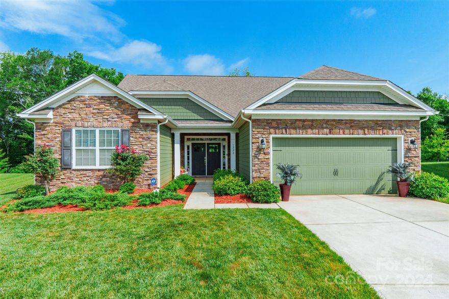 Stunning 5 bedroom, 3.5 bathroom home nestled on a peaceful cul-de-sac with gorgeous curb appeal & an inviting front entry foyer. Step inside to discover 11ft ceilings and an open, bright floor plan, complete with a kitchen featuring granite countertops, a breakfast bar, a walk-in pantry, and top-of-the-line SS appliances. The kitchen overlooks the great room, highlighted by a cozy fireplace. The main level also hosts 3 bedrooms, including a luxurious primary suite with tray ceilings, an ensuite bathroom with dual vanity, and an oversized shower. An additional office space off the dining room provides flexibility. Upstairs, 2 more bedrooms and a generous bonus room await. Outside, a covered patio & stone firepit offers an ideal space for outdoor relaxation. Other notable features include, epoxy flooring in garage, surround sound system, clean water system & patio has a natural gas connection for a grill. Perfectly situated near Lake Wylie, this home offers both elegance & comfort!