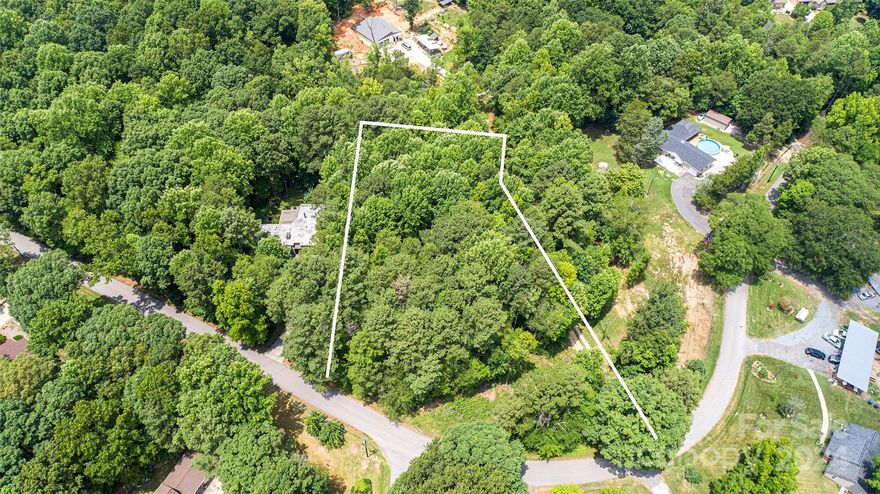 This beautiful wooded property awaits your new dream home in desirable Indian Land.  This is a very private street with wooded homesites, yet convenient to retail shopping and restaurants.