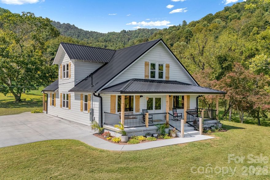 Ideally positioned on 10.56 acres of rolling pastures, this fully remodeled early 1900s farmhouse embodies the quintessential Appalachian homestead — blending timeless charm with modern comforts. This is the true definition of a Modern Farmhouse, and no expense was spared in its thoughtful renovation. The welcoming covered front porch sets the stage for postcard-worthy mountain views. Step inside to a light-filled living area that is ideal for joyful everyday living. The chef’s kitchen impresses with gourmet appliances, a butcher block island, and fine finishes. The main level also features a primary bedroom with ensuite bath, plus a mudroom/laundry and an additional full bath. Upstairs, discover three large bedrooms and a full bath, providing abundant space for family or guests. Outdoor living is equally inviting on the beautiful land with a spring-fed creek, tractor shed, and barn. Also included is a updated 3/2 manufactured home —ideal as a guesthouse or rental. Located only minutes from the awesome town of Marshall, this property invites endless possibilities as a private retreat, hobby farm, subdivision, rentals, or your vision. Don't miss this special property!