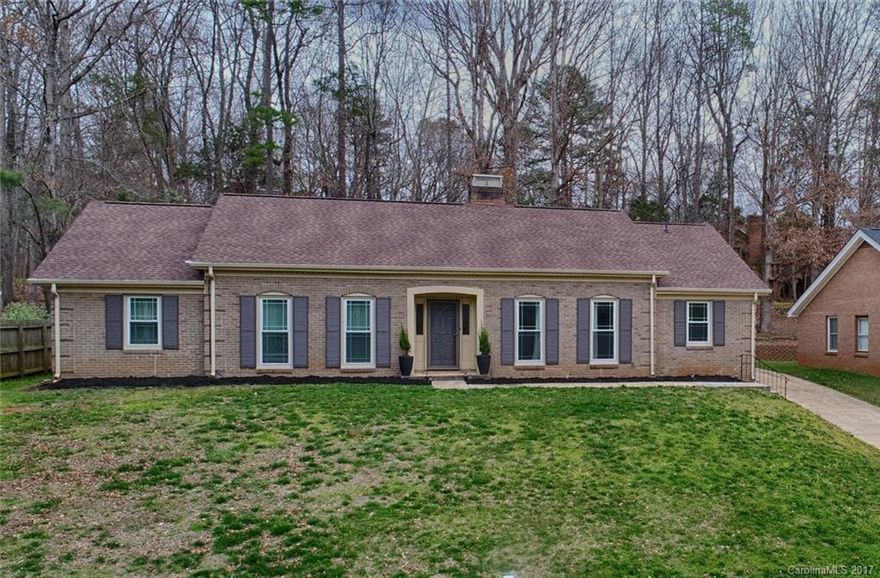 Charming full brick ranch home in the sought after Raintree development of South Charlotte. Cul-de-sac street, wooded lot, recent addition & updates galore! NEW, fabulous master bath w/ walk out shower & soaking tub just completed. Hand scrapped hardwoods, updated gourmet kitchen w/ granite and SS appliances. Fenced yard with lovely outdoor patio & entertaining area. Secondary bedroom with on suite bathroom. Convenient location to highways, shopping & dining, short commute to uptown Charlotte.